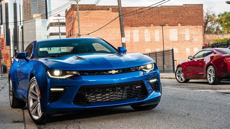 Blue and red sports cars parked