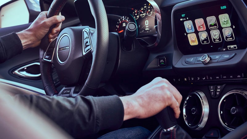 Driver hands on steering wheel