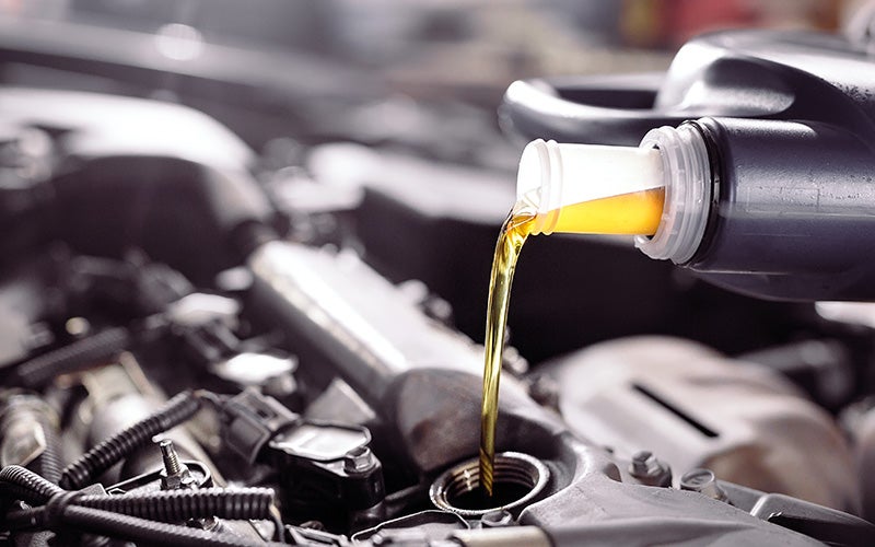 Oil being poured into an engine